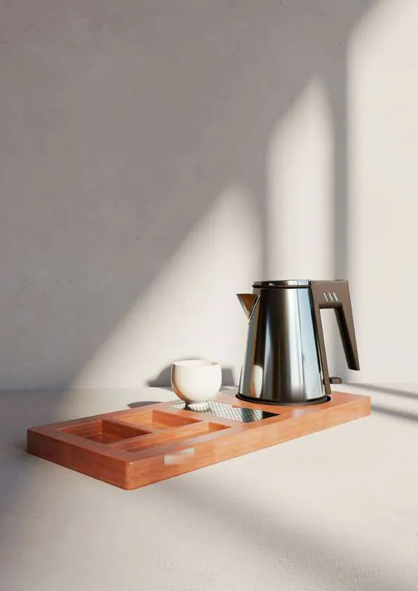Plateau d’accueil avec bouilloire, tasses et sachets de thé