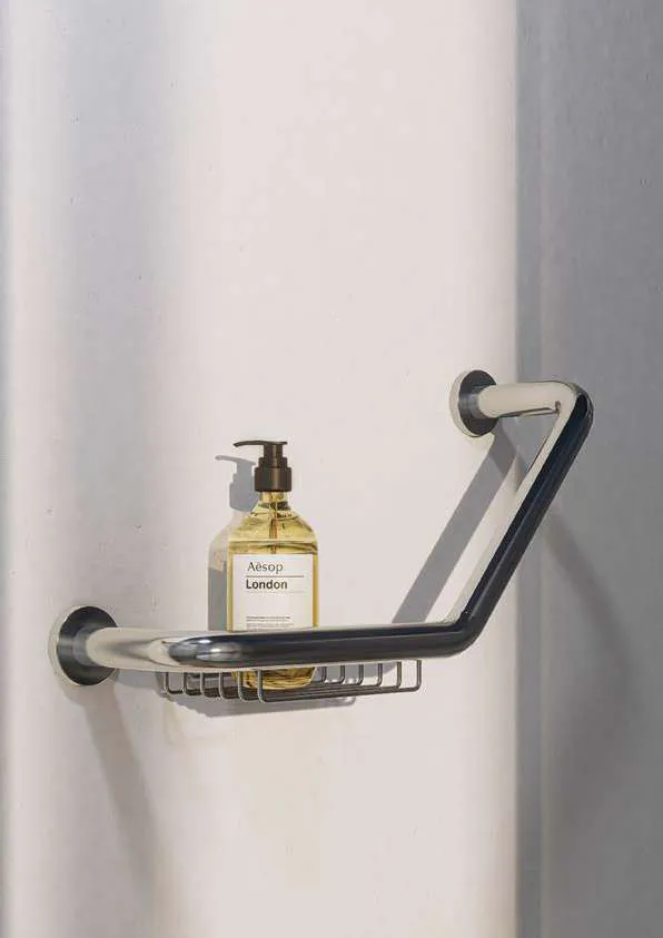 Shower grab handle with soap dish and a bottle of shower gel